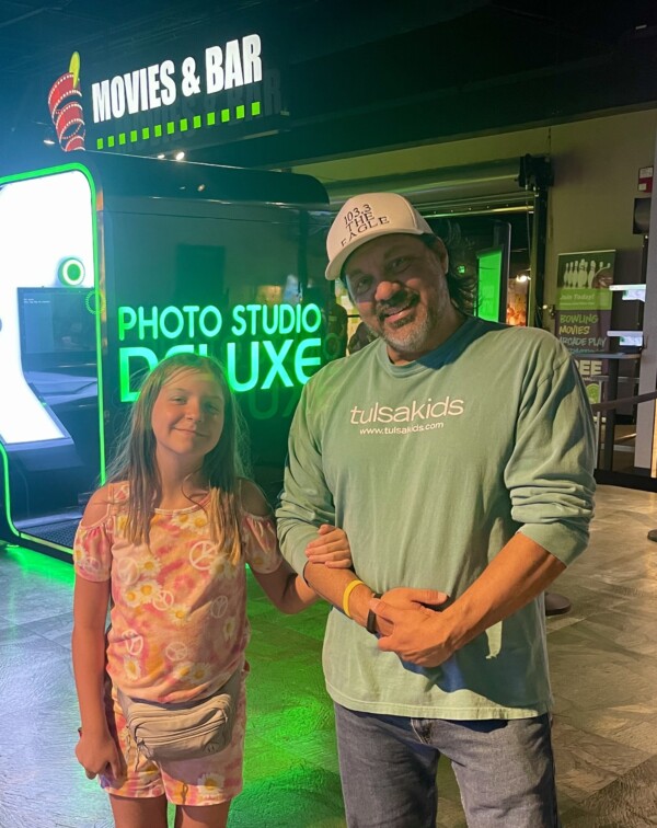 lynn hernandez and his daughter at cinergy tulsa to see despicable me 4