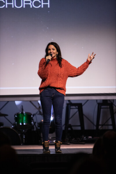 Pastor Melody Dixon on stage at Midtown Tulsa